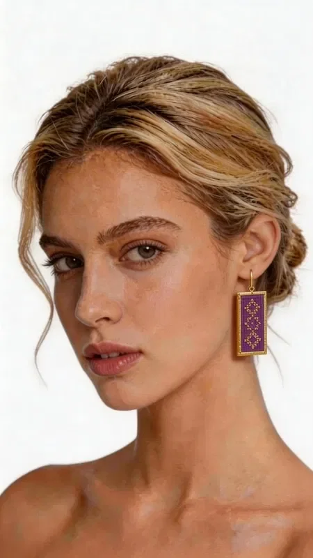 , The statement embroidered earrings with geometric patterns in gold thread and a striking burgundy color are the perfect accessory for every woman who wants to stand out. Designed by Greek Jewelry Designer Aikaterini Chalkiadaki, these handmade earrings combine the traditional art of embroidery with modern design.

The luxurious gold thread creates refined geometric motifs that highlight the mastery of Greek craftsmanship. The deep burgundy color offers elegance and style, while the rectangular shape of the earrings makes them ideal for formal events, weddings, or evening outings.

These striking dangle earrings are suitable for women who love original handmade jewelry with a distinctive aesthetic. They pair perfectly with monochrome outfits and add a boho touch to your look.

Material: Brass, Fabric

To preserve their beauty, store the earrings in a dry place and avoid contact with water and chemical products.