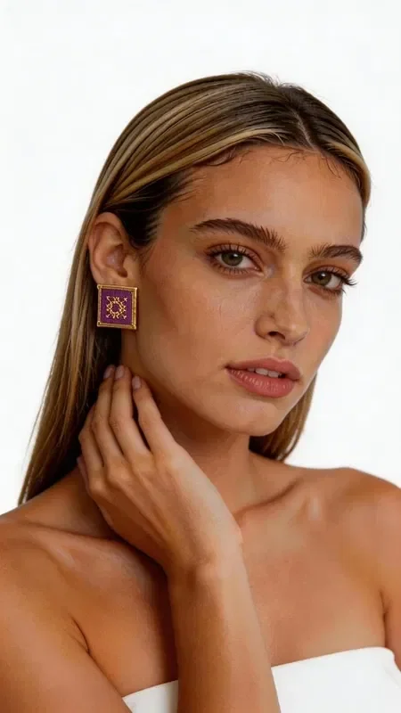 , The statement earrings embroidered with gold thread in a striking burgundy color are the ideal choice for women seeking unique style and elegance. These handmade earrings, designed by Greek Jewelry Designer Aikaterini Chalkiadaki, stand out for their impressive geometric patterns and high-quality craftsmanship. The square shape with gold outlines and richly embroidered surface creates a unique combination of traditional technique and modern design. The deep burgundy color offers luxury and elegance, while the gold details add shine and sophistication.

These eye-catching earrings are perfect for special occasions such as weddings, events, or evening outings, but they can also elevate your everyday look. Greek craftsmanship and attention to detail make them unique pieces that will stand out in your collection.

Material: Brass, Fabric

Handle with care, avoiding contact with water and perfumes to preserve their shine.