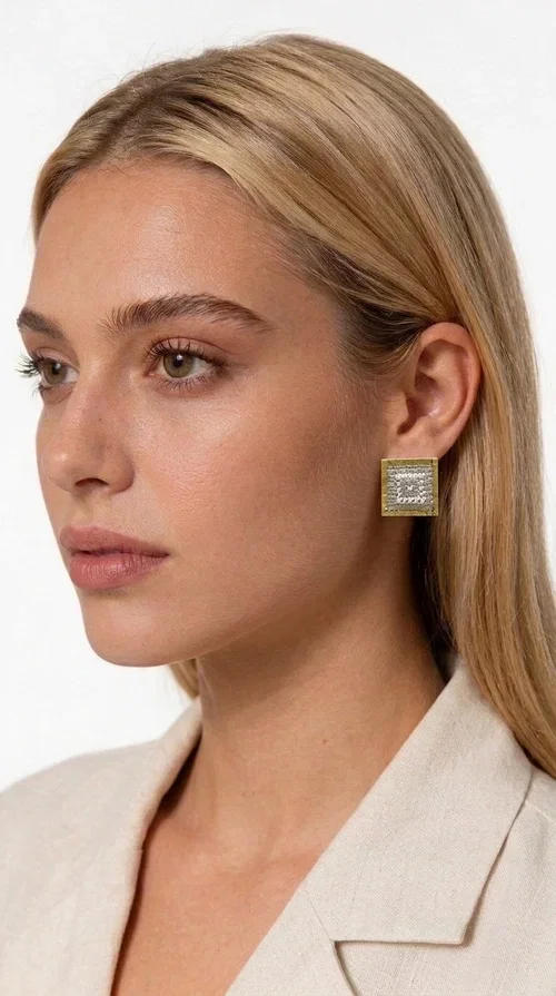 , The embroidered statement earrings with geometric patterns in a cream shade are the ideal choice for every woman who wants to add a unique, handmade touch to her style. With a square shape and detailed embroidery that creates striking geometric motifs, these earrings combine the tradition of folk embroidery with a modern, minimal aesthetic. Designed by Greek Jewelry Designer Aikaterini Chalkiadaki, they are a piece with authentic Greek character.

Made of brass and fabric, these earrings feature a gold metallic frame surrounding a delicate embroidered section in cream-white tones. The result is a piece of jewelry with depth of texture and character, equally suited to casual looks and formal occasions — from an everyday outfit with a linen blazer to an evening look or a wedding ceremony.

The geometric embroidered designs highlight the craftsmanship of handmade construction, while the cream shade ensures versatility when paired with neutral, earthy, or even bold color palettes.
