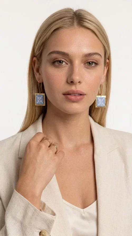 , The embroidered statement earrings with geometric designs in light blue are a bold choice for every woman who wants to express herself through her jewelry. Designed by Greek Jewelry Designer Aikaterini Chalkiadaki, these striking handmade earrings combine the traditional art of embroidery with a modern, geometric aesthetic.

Their square shape, featuring a gold-tone brass hoop, highlights the light blue embroidered fabric adorned with delicate geometric details — a result that evokes Greek folk art and a folklore aesthetic. Each pair is unique thanks to its handmade craftsmanship, making it a true treasure for your collection.

Ideal for weddings, christenings, formal occasions, and even for elevating an everyday look, these earrings pair beautifully with white, ecru, or blue outfits. Lightweight to wear and comfortable to have on.