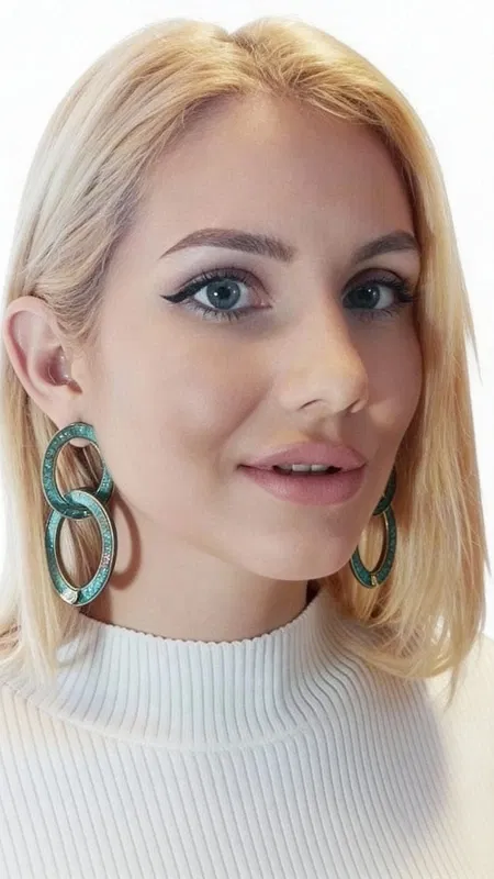 , These striking dangle earrings showcase a captivating fusion of organic beauty and contemporary design, featuring lustrous freshwater pearls nestled within artistic copper circles adorned with a weathered green patina finish. The unique interlocking double-circle design creates dynamic movement and visual interest, making these statement pieces perfect for the modern woman who appreciates distinctive handmade jewelry.
Crafted with meticulous attention to detail, each earring features genuine freshwater pearls that catch and reflect light beautifully, creating an elegant contrast against the oxidized copper's rich green patina. The weathered finish gives these earrings an authentic, vintage-inspired aesthetic while maintaining a thoroughly contemporary appeal. The substantial size and bold silhouette make these earrings ideal conversation starters that effortlessly elevate any outfit.
Drawing inspiration from Greek artisan traditions, these handmade treasures blend classical elegance with modern sophistication. The organic patina finish ensures that each pair develops its own unique character over time, making your earrings truly one-of-a-kind. Their versatile design transitions seamlessly from casual daytime looks to elegant evening ensembles, complementing both bohemian and sophisticated styles.
The secure hook closure ensures comfortable all-day wear, while the lightweight construction prevents ear fatigue despite their impressive presence. These earrings make an exceptional gift for anyone who appreciates artisan-crafted jewelry with distinctive character and timeless appeal.
Store in a dry place away from moisture. Clean gently with a soft cloth, avoiding harsh chemicals that may affect the natural patina finish.