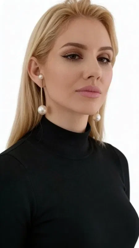 , Discover the magic of large statement dangle earrings with double pearl, a piece of jewelry that combines classic beauty with a modern aesthetic. These unique handmade earrings, designed by Greek Jewelry Designer Aikaterini Chalkiadaki, are the perfect choice for the woman who wants to stand out.

The linear design in gold-toned brass creates an elegant movement that complements the natural luster of the pearls. One end features a small pearl that adds delicacy, while the opposite end showcases a larger pearl that adds weight and elegance. This combination creates a balanced design that moves gently with every motion.

These long earrings are ideal for special occasions, weddings, formal events, and for elevating your everyday look. The quality of the brass ensures durability and lasting color.