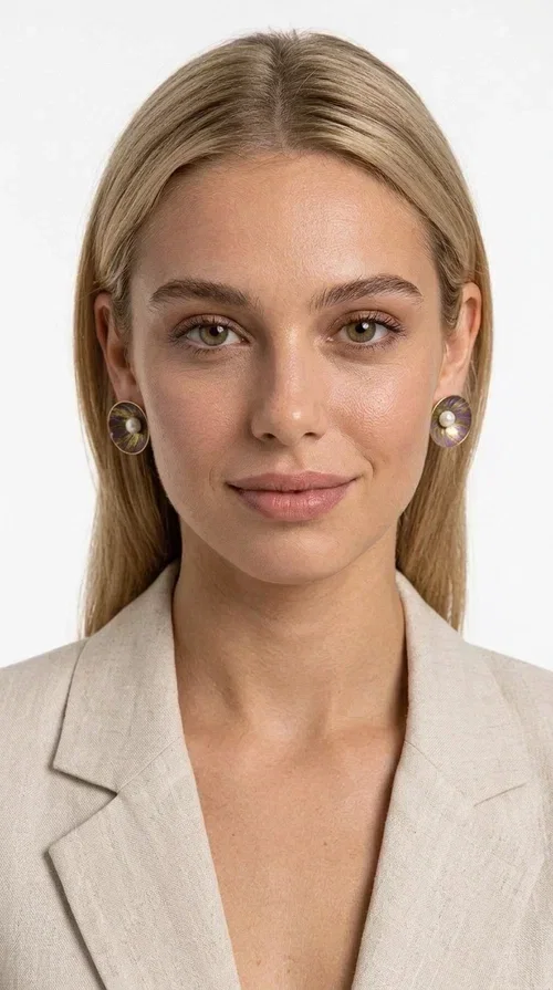 , Handmade purple stud earrings with pearls are an elegant choice for every woman seeking jewelry with character and feeling. Designed by Greek Jewelry Designer Aikaterini Chalkiadaki, these unique earrings combine refined aesthetics with the durability of brass and the warmth of handmade enamel, creating a result that truly stands out.

Each pair features a circular shape in a lilac-purple hue with golden brass details, while a natural pearl takes center stage, adding charm and femininity. The matte texture of the enamel combined with the soft shine of the pearl creates a contrast that makes the piece stand out both in everyday looks and in formal occasions, weddings and christenings.

Ideal as a gift or for personal use, they pair beautifully with minimal outfits, casual style, and formal looks alike. Their lightweight construction ensures comfort for everyday wear.