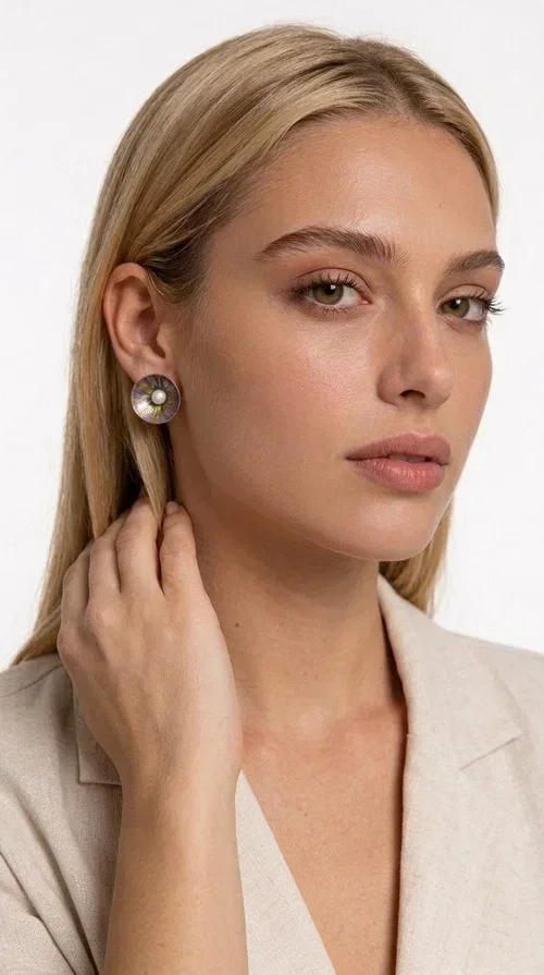 , Handmade purple stud earrings with pearls are an elegant choice for every woman seeking jewelry with character and feeling. Designed by Greek Jewelry Designer Aikaterini Chalkiadaki, these unique earrings combine refined aesthetics with the durability of brass and the warmth of handmade enamel, creating a result that truly stands out.

Each pair features a circular shape in a lilac-purple hue with golden brass details, while a natural pearl takes center stage, adding charm and femininity. The matte texture of the enamel combined with the soft shine of the pearl creates a contrast that makes the piece stand out both in everyday looks and in formal occasions, weddings and christenings.

Ideal as a gift or for personal use, they pair beautifully with minimal outfits, casual style, and formal looks alike. Their lightweight construction ensures comfort for everyday wear.