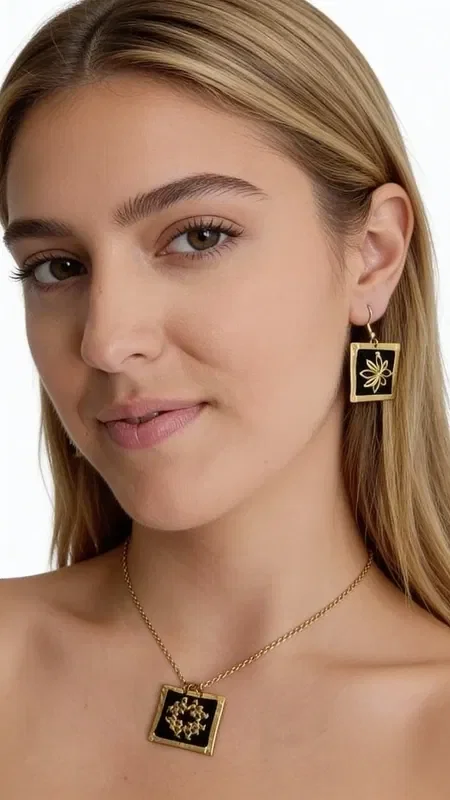 , These embroidered statement earrings with gold thread on a black background are a striking choice that combines the traditional Greek art of embroidery with modern design. Designed by Greek Jewelry Designer Aikaterini Chalkiadaki, these handmade earrings stand out for their exceptional quality and unique aesthetic.

The geometric patterns in gold thread create a striking visual contrast against the black base, offering elegance and style. Their square shape and dangling design make them ideal for special occasions such as weddings or christenings, or for adding a striking touch to your everyday look.

These modern embroidered earrings are perfect for women who love statement jewelry and are looking for something special and original. The art of handmade embroidery gives each piece uniqueness and authenticity. Be sure to store them in a dry place and clean them gently with a soft cloth to preserve their beauty.