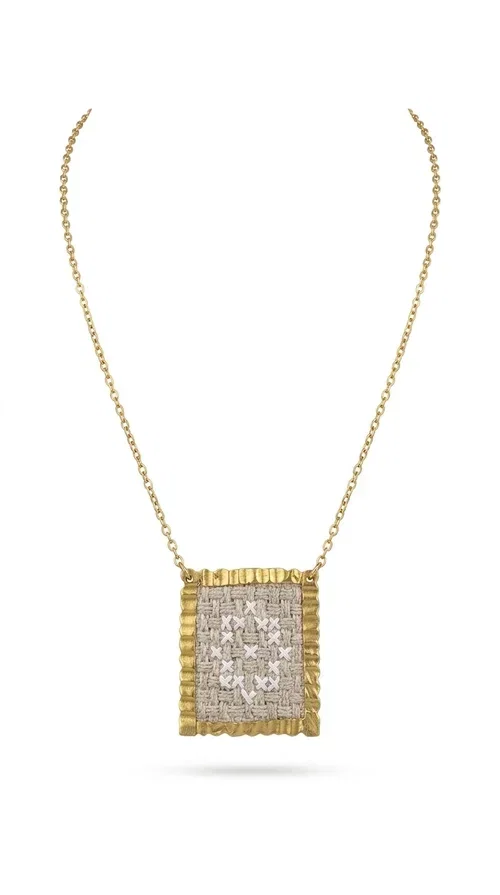 , A statement embroidered necklace that combines tradition with contemporary style — ideal for those who love striking jewelry with character. Designed by Greek Jewelry Designer Aikaterini Chalkiadaki, this handmade necklace features geometric embroidered patterns in cream tones, inspired by folk art and Greek tradition. The square pendant with a brass frame and fabric surface makes for a unique piece of jewelry that stands out from the ordinary.

The delicate gold-tone chain highlights the pendant, making it stand out in both casual and more formal looks. The geometric embroidered motifs give a sense of vintage elegance, while the cream tones make it versatile — pairing well with dresses, jackets, and even casual outfits. An ideal gift for women who appreciate handmade jewelry with a Greek soul.