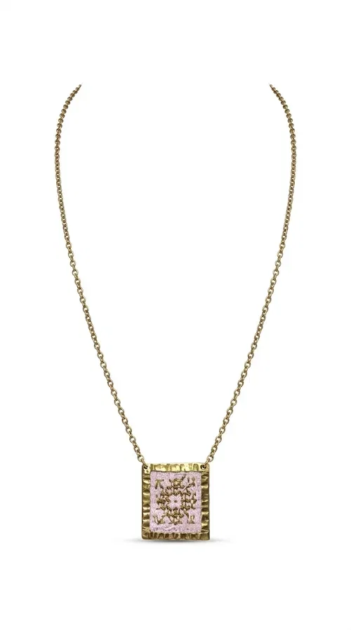 , An embroidered necklace that combines the traditional art of embroidery with a modern aesthetic — ideal for every woman who loves statement jewelry with character. Designed by Greek Jewelry Designer Aikaterini Chalkiadaki, this handmade necklace is a unique example of folklore-inspired aesthetics drawing from Greek tradition.

The square pendant in pink and gold tones is adorned with geometric patterns embroidered on fabric, set into a gold-tone brass base with a textured surface. The gold rolo chain gives the piece an elegant, contemporary touch that makes it easy to style — whether with an everyday casual look or an evening outfit.

The pink palette with gold embroidered details offers a warm, feminine feel, while the handmade construction guarantees uniqueness. An ideal gift for women who appreciate jewelry with history and soul.