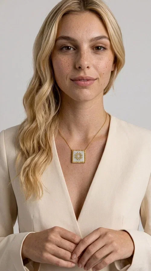 , The embroidered necklace with geometric patterns is a statement piece of jewelry that combines the traditional art of embroidery with a modern, minimal aesthetic. Designed by Greek Jewelry Designer Aikaterini Chalkiadaki, this necklace is a handmade piece with strong character — ideal for women who appreciate authenticity and want to stand out.

The square pendant is adorned with white embroidery in geometric motifs inspired by folk tradition, while the gold-toned brass frame adds warmth and elevates the level of elegance. The gold-tone chain blends softly into the overall look, creating a piece of jewelry that suits casual looks just as well as formal occasions.

Wear it over a white t-shirt or under a blazer for an effortless chic look. It also makes a wonderful gift for women who love handmade jewelry with a Greek identity.