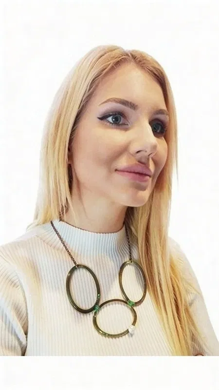 , This captivating statement necklace transforms your look with its bold geometric design and luxurious mixed materials. The striking centerpiece features interconnected circular elements crafted from oxidized copper, showcasing a beautiful green patina that creates an authentic vintage aesthetic with contemporary appeal.
Each lustrous freshwater pearl is carefully positioned to complement the oxidized metal circles, creating a sophisticated contrast between organic elegance and industrial artistry. The piece is suspended from a quality brass chain that adds warmth and durability to the overall design. This unique combination of materials reflects exceptional Greek craftsmanship, where traditional metalworking techniques meet modern jewelry design sensibilities.
The necklace's substantial presence makes it perfect for elevating both casual and formal ensembles. Layer it over a crisp white shirt for professional sophistication, or pair it with flowing fabrics for bohemian elegance. The green patina finish beautifully complements earth tones, neutrals, and jewel colors alike.
What sets this piece apart is its artistic balance – substantial enough to make a statement yet refined enough for versatile styling. The oxidized copper's natural aging process ensures each necklace develops its own character over time, making your piece truly one-of-a-kind.
To maintain the beautiful patina finish, gently clean with a soft cloth and store in a dry place. Avoid exposure to harsh chemicals or excessive moisture to preserve the copper's distinctive green coloring and the pearls' natural luster.