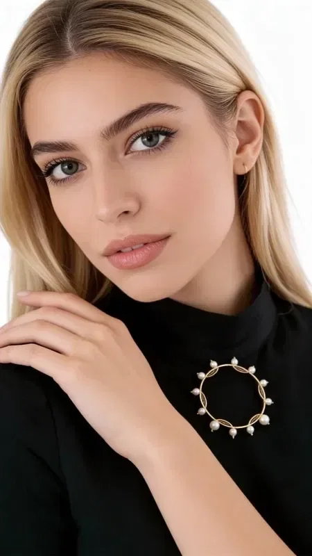 , Refresh your look with this striking statement set of 3 brooches with pearls, a unique piece of jewelry that combines modern design with classic elegance. Designed by Greek Jewelry Designer Aikaterini Chalkiadaki, this handmade set includes three geometric brooches with a gold finish and white pearls.

Each brooch features a different design - a circle with pearls around its edge, a circle with horizontal lines and pearls, and a smaller brooch with dangling elements. The golden hue and elegant pearls create a harmonious ensemble that instantly adds glamour to any look. Perfect to wear together on a blouse, jacket or dress, or separately for more subtle styling.

These handmade brooches are the perfect accessory for women who love unique styling and quality jewelry. Store them in a dry place and gently clean them with a soft cloth to preserve their shine.