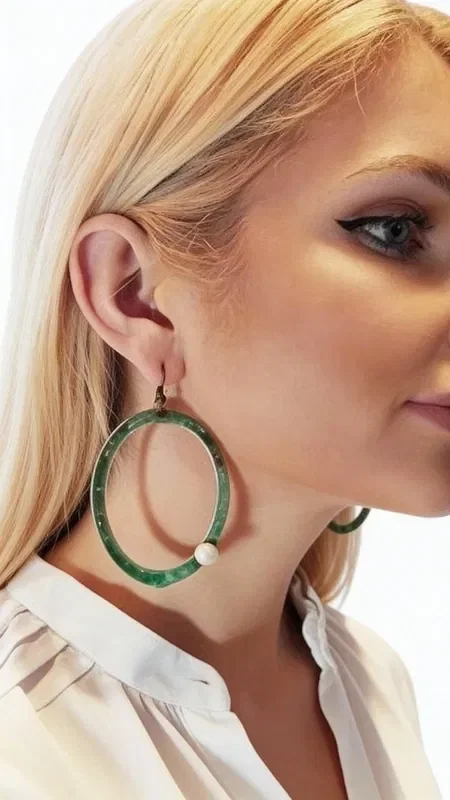 , Striking dangle hoop earrings with pearls that combine the natural beauty of pearls with authentic Greek craftsmanship. Designed by Greek Jewelry Designer Aikaterini Chalkiadaki, these unique handmade earrings are the perfect choice for the woman seeking original jewelry with character.

The green patina covering the copper creates a vintage aesthetic that suits both everyday and formal looks. The white pearls add elegance and brightness, creating a perfect combination that highlights the natural beauty of the face. The special treatment of the copper gives each piece a unique character.

These modern dangle earrings are ideal for weddings, evening outings, or whenever you want to add a touch of bohemian elegance to your everyday style. Store in a dry place and clean gently with a soft cloth to preserve the shine of the pearls and the patina of the copper.