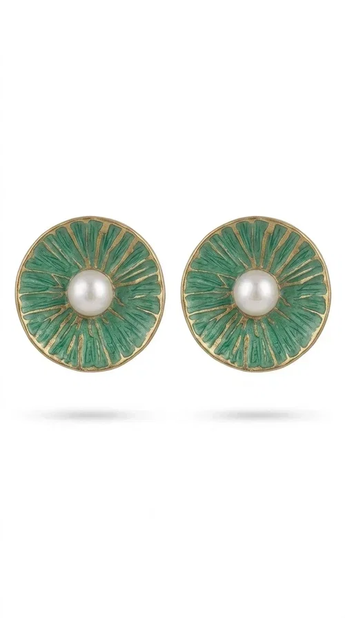 , Handmade stud earrings with pearls in deep green are a choice that combines elegance and character, ideal for every woman who loves accessories with personality. Designed by Greek Jewelry Designer Aikaterini Chalkiadaki, these earrings are a unique combination of handmade artistry and contemporary aesthetics.

Made of brass and enamel in a vivid green tone, these earrings feature a central pearl that adds a delicate, feminine touch to a bold design. Their round, disc-shaped form with a woven-textured enamel surface creates an interesting visual texture that catches the eye without being overwhelming. The result is a piece of jewelry that stands on its own — the perfect statement piece for both everyday and evening looks.

They pair equally beautifully with casual outfits, professional looks, and formal events such as weddings and christenings. The green color flatters every skin tone and blends harmoniously with neutral, white, and bold colors alike.